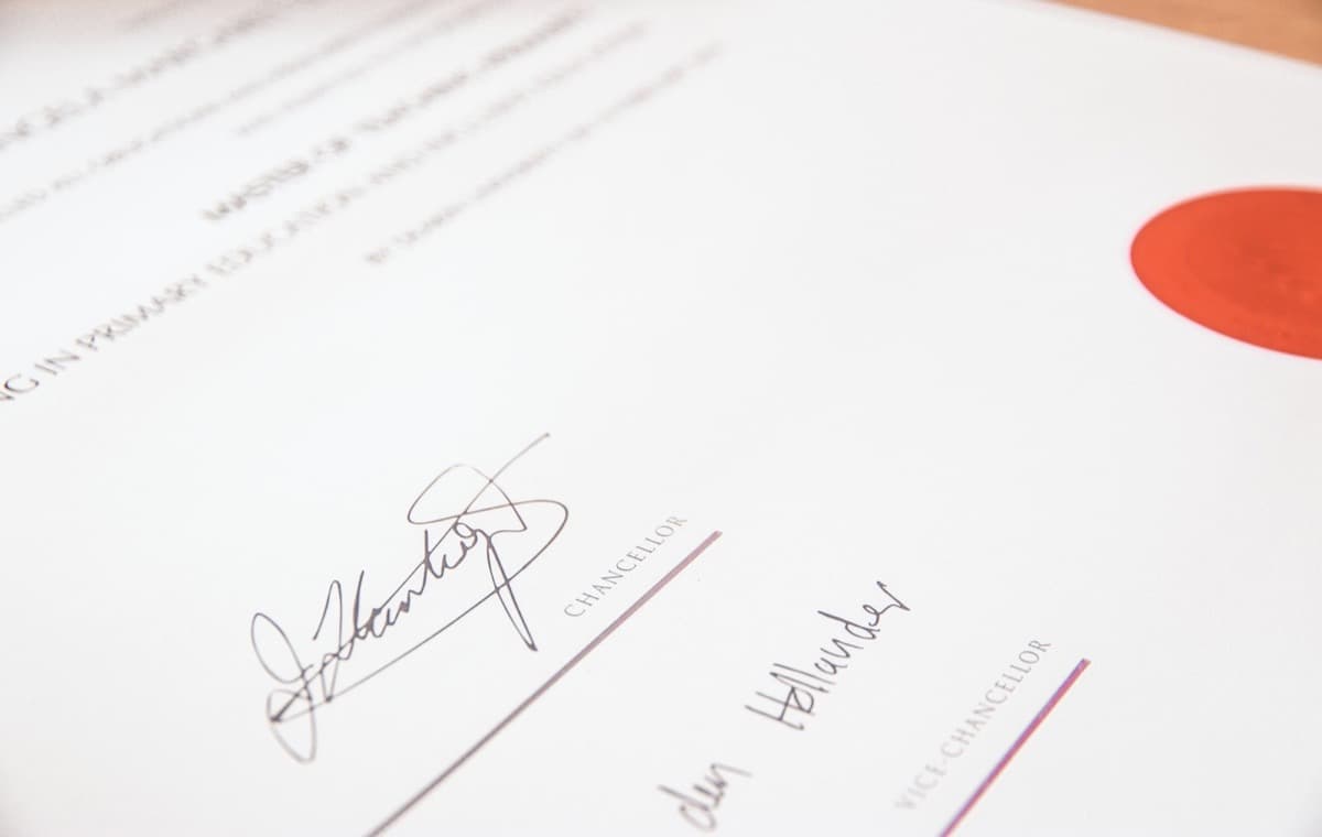 Close-up of an embossed certificate seal on official paper